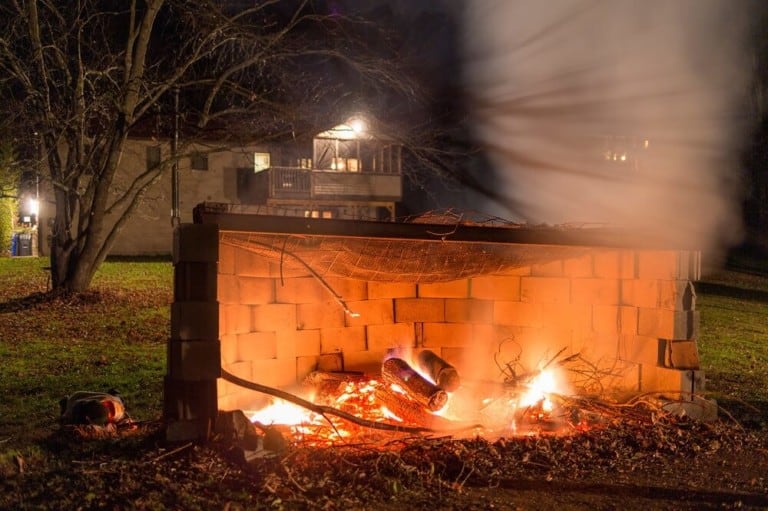 roaring pit fire with cinder blocks