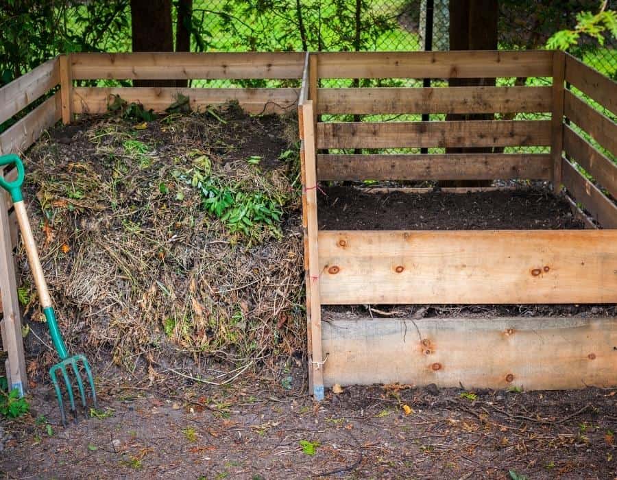 compost bins with compost for improving garden soil in winter