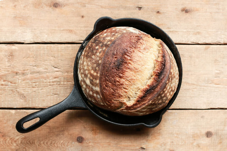 homemade sourdough bread baking with cast iron