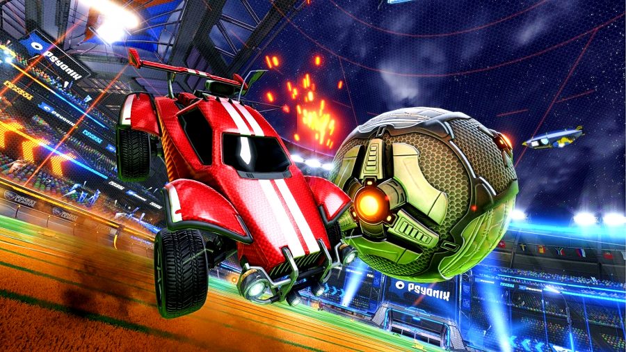 Rocket League - a red car intercepts a large ball in mid-air over a football-style pitch