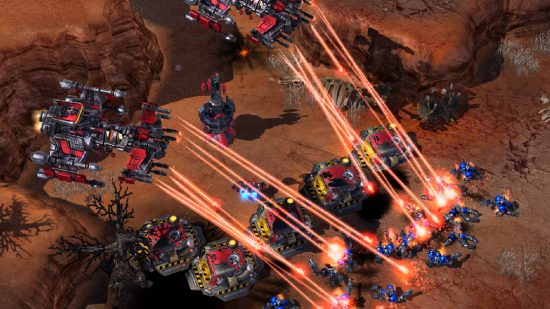 Best Strategy games - two massive airships are roasting enemies with lasers in blue in StarCraft 2.