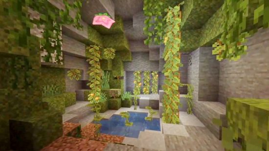 Minecraft lush caves: Lush caves are home to the Spore Blossom, a pink flower that appears on the ceiling of a small cave opening, surrounded by other lush cave plant life, like green drip leave and orange glow berries.