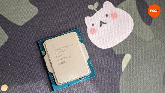 The Intel Core i5 14900K (left) against a black and leafy background, with cat-like figure (right)