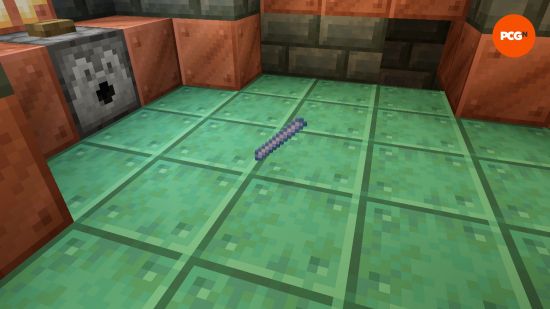 A Minecraft Breeze Rod, one of the Breeze drops, sits on the floor of a trial chamber.