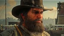 GTA Red Dead Redemption 2 new studio: A man wearing a western-style cowboy hat with a thick beard looks stern