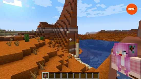 A player holds a custom totem in the Custom Totem texture pack, one of the best Minecraft texture packs.