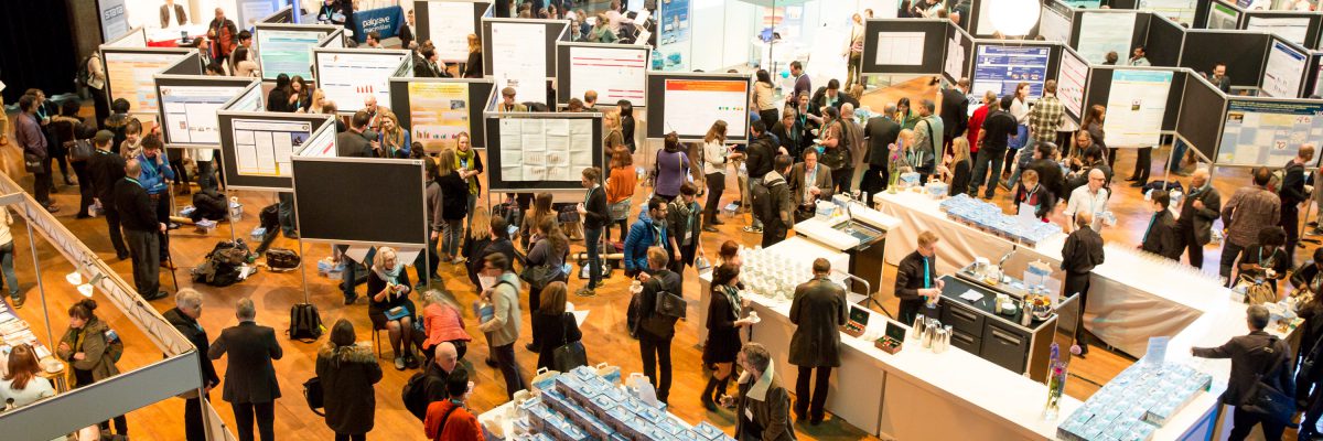 Convention Archive featured image of a poster session in full swing.