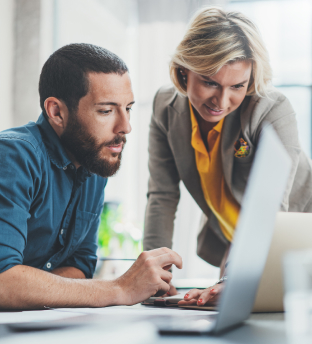 workers looking at desktop