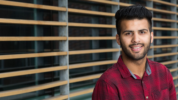 A top up degree student posing for a photo