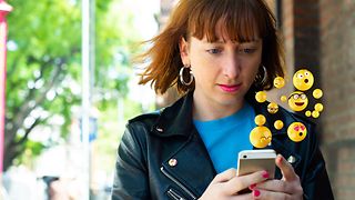 Young woman checking messages on her smartphone.