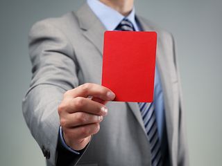 Man showing a read card.