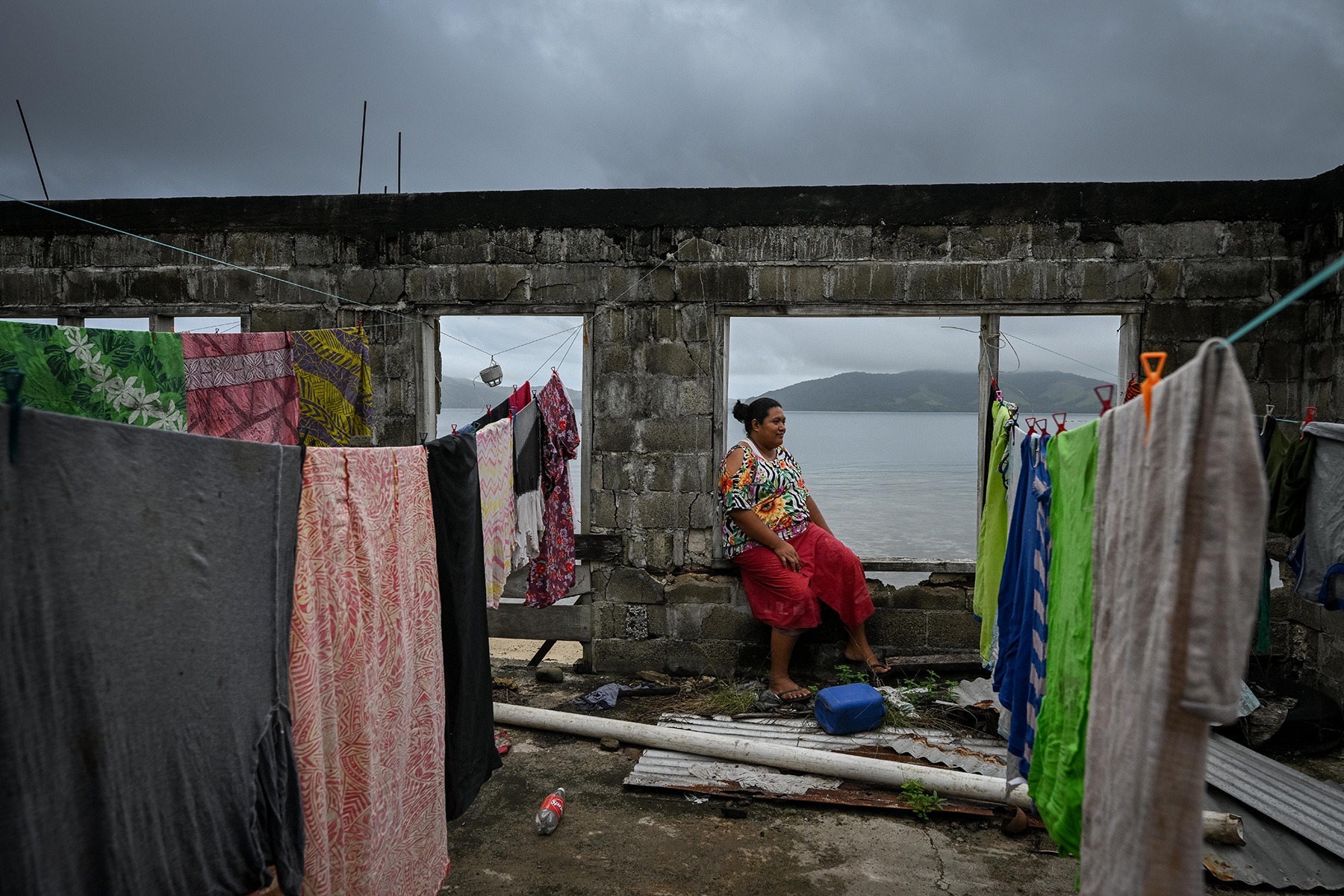 A woman sitting and watching outside