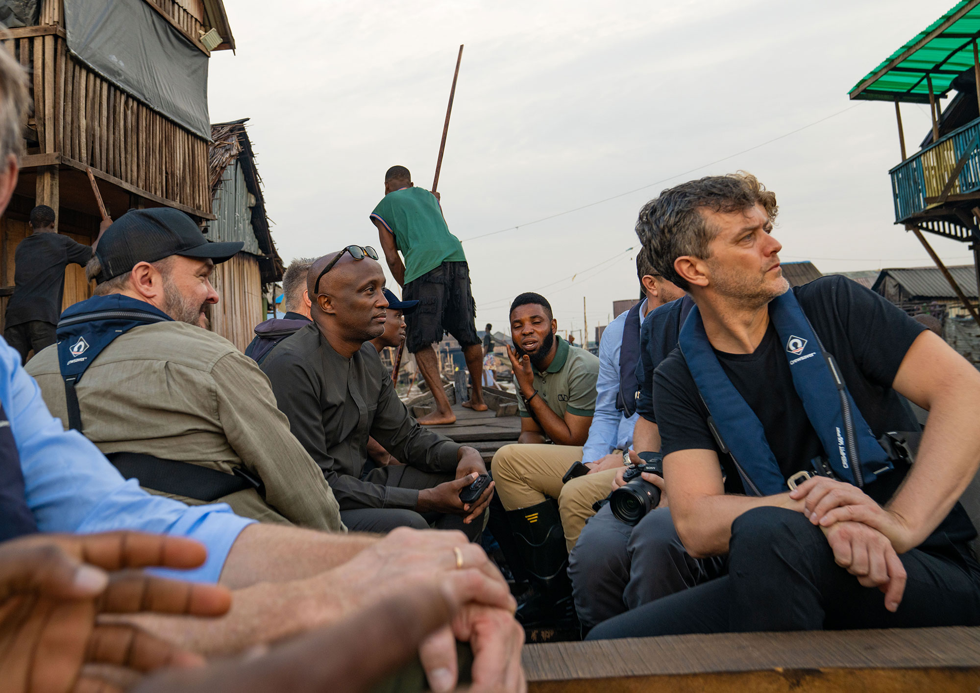 Another angle on the same photo of Mohamed Yahya and the Danish Minister for Development touring informal settlements built on stilts.