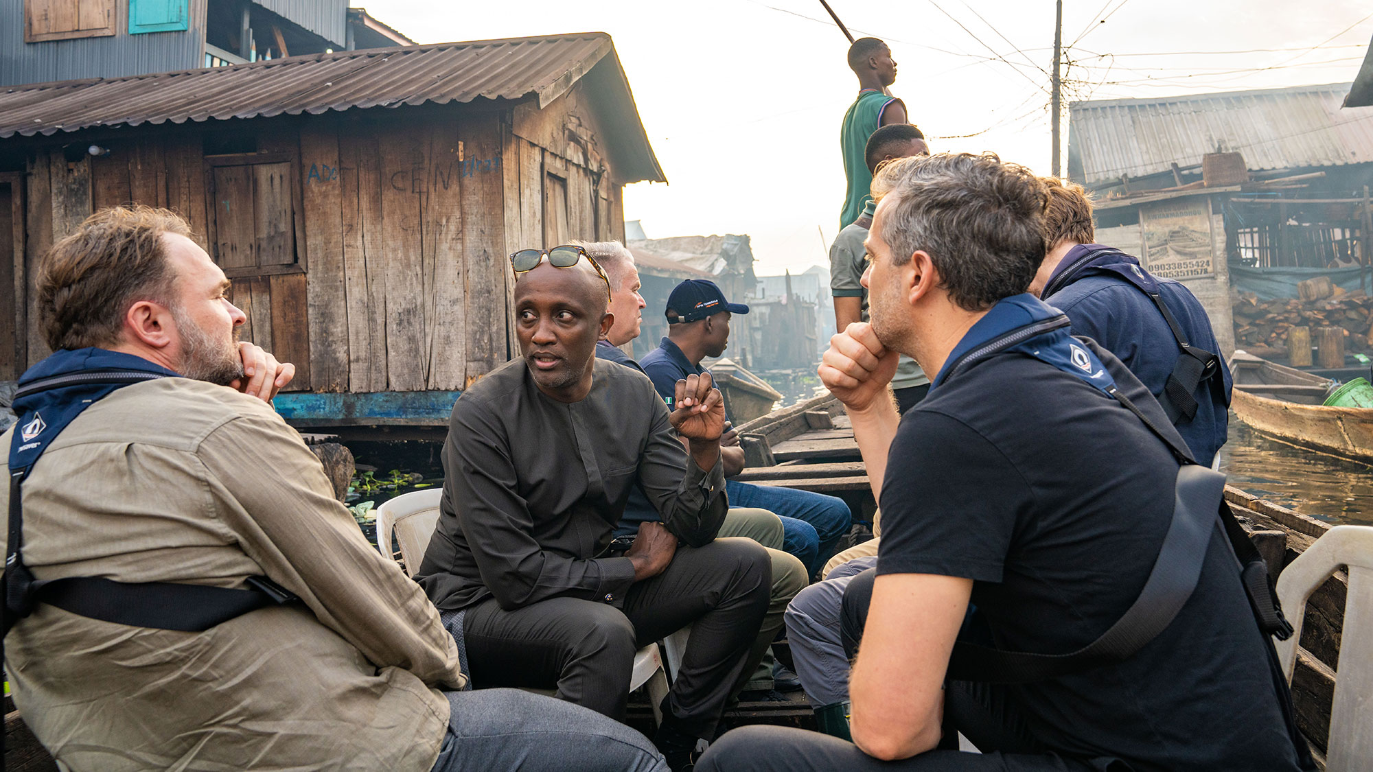 Another angle on the same photo of Mohamed Yahya and the Danish Minister for Development touring informal settlements built on stilts.