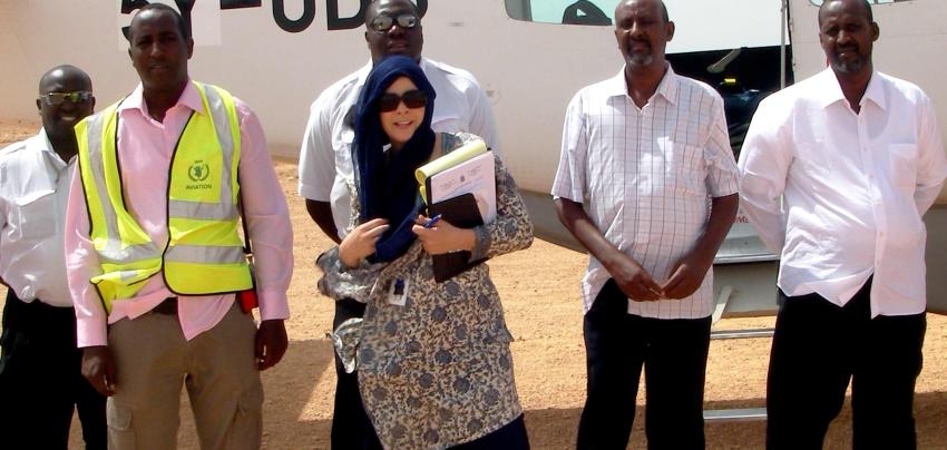 UN aircraft with staff and locals